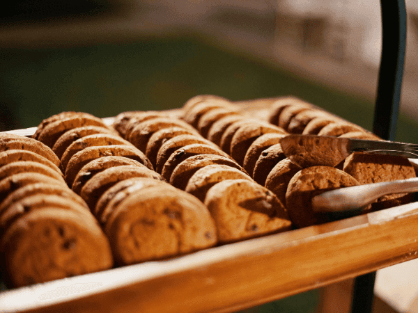 A rustic wooden tray displaying delicious cookies, an inspiration for starting a cottage food business in Maryland.